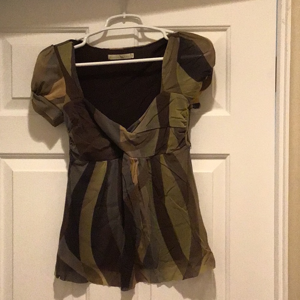 Nylon top with short sleeves and nice detailing at the bust.